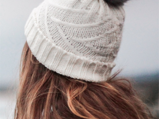 Knitted white pompom cap